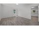 Bright, airy room featuring updated gray flooring and a window with a pleasant outdoor view at 37 Weeping Willow Ln, Lillington, NC 27546