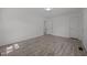 Spacious bedroom with modern flooring, neutral paint, and access to the hallway at 37 Weeping Willow Ln, Lillington, NC 27546