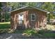 Brick exterior includes a covered entrance and a small window at 37 Weeping Willow Ln, Lillington, NC 27546
