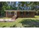 Charming one-story brick home with a well-maintained lawn and classic black shutters at 37 Weeping Willow Ln, Lillington, NC 27546