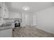Open-concept kitchen features modern appliances and stylish flooring at 37 Weeping Willow Ln, Lillington, NC 27546
