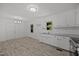 Kitchen and dining area boasts ample natural light and modern fixtures at 37 Weeping Willow Ln, Lillington, NC 27546