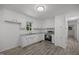 Bright kitchen with stainless steel appliances and sleek wood-look flooring at 37 Weeping Willow Ln, Lillington, NC 27546