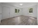 Bright living room featuring new laminate flooring and windows for natural light at 37 Weeping Willow Ln, Lillington, NC 27546