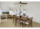Relaxing covered patio offers outdoor dining with a wooden table and chairs, along with comfortable lounge seating at 380 Shelby Meadow Ln, Angier, NC 27501