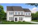 Charming two-story home with a well-maintained front yard, neutral siding, a dark roof, and an attached two-car garage at 380 Shelby Meadow Ln, Angier, NC 27501