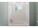 Bright white bathroom with white subway tile in shower at 3934 Old Chapel Hill Rd, Durham, NC 27707