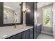 Elegant bathroom with quartz countertops, modern fixtures, and a glass-enclosed marble shower at 3934 Old Chapel Hill Rd, Durham, NC 27707