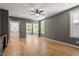 Bedroom with natural light, a ceiling fan, and light wood floors at 3934 Old Chapel Hill Rd, Durham, NC 27707