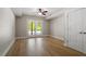 Large bonus room with hardwood floors and sliding glass doors to backyard at 3934 Old Chapel Hill Rd, Durham, NC 27707