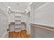 Walk-in closet with custom shelving and rod system at 3934 Old Chapel Hill Rd, Durham, NC 27707