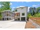 Modern home exterior with a two-car garage, private patios, and beautiful design at 3934 Old Chapel Hill Rd, Durham, NC 27707