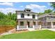 Inviting two-story home with a charming front porch and lush green lawn, perfect for outdoor enjoyment at 3934 Old Chapel Hill Rd, Durham, NC 27707