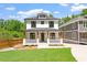 Charming two-story home featuring a welcoming front porch and a well-manicured lawn at 3934 Old Chapel Hill Rd, Durham, NC 27707