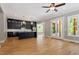 Modern kitchen with black cabinets, island, stainless steel appliances, and glass doors at 3934 Old Chapel Hill Rd, Durham, NC 27707