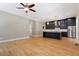 Open kitchen with dark cabinetry, stainless steel appliances, and modern lighting at 3934 Old Chapel Hill Rd, Durham, NC 27707