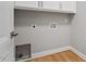 Laundry room featuring hookups and cabinets above, ready for appliances at 3934 Old Chapel Hill Rd, Durham, NC 27707