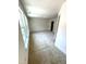 A bright, carpeted bedroom featuring a large window allowing natural light at 408 La Maison Ave # 3, Wendell, NC 27591