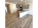 This stylish kitchen features granite countertops, stainless appliances and luxury vinyl plank flooring at 408 La Maison Ave # 3, Wendell, NC 27591
