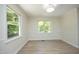 Bright dining room with large windows and light wood floors; perfect for entertaining at 409 Glaive Dr, Durham, NC 27703