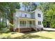 Charming two-story home with a welcoming front porch and beautifully landscaped yard at 409 Glaive Dr, Durham, NC 27703