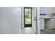 The hallway leads to the laundry room and an exterior door to the backyard at 409 Glaive Dr, Durham, NC 27703