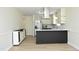 Modern kitchen with stainless steel appliances, a center island, and ample counter space at 409 Glaive Dr, Durham, NC 27703