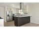 Modern kitchen with stainless steel appliances and a stylish center island, ready for cooking at 409 Glaive Dr, Durham, NC 27703