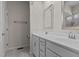 Bright bathroom features double sinks, white cabinets, and framed mirrors at 417 Austin View Blvd, Wake Forest, NC 27587