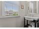 Bright bathroom with a stylish vanity, large window with blinds, and clean design at 417 Austin View Blvd, Wake Forest, NC 27587