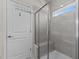Modern bathroom features a tiled shower with glass door and a convenient built-in bench at 417 Austin View Blvd, Wake Forest, NC 27587