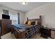 Spacious bedroom features a large bed, modern furniture, and large window at 417 Austin View Blvd, Wake Forest, NC 27587