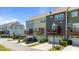 Townhome features a garage, driveway, balcony, and well-manicured landscaping at 417 Austin View Blvd, Wake Forest, NC 27587