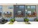 Townhome features a garage, driveway, balcony, and well-manicured landscaping at 417 Austin View Blvd, Wake Forest, NC 27587