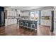 Bright kitchen featuring a large island, stainless steel appliances, and stylish cabinetry at 417 Austin View Blvd, Wake Forest, NC 27587