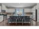 Modern kitchen with a spacious island, seating, and elegant fixtures at 417 Austin View Blvd, Wake Forest, NC 27587