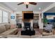 Inviting living room featuring a fireplace, open shelving, and comfortable furniture arrangement at 417 Austin View Blvd, Wake Forest, NC 27587