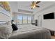 Spacious primary bedroom features comfortable decor, natural light, and a tray ceiling at 417 Austin View Blvd, Wake Forest, NC 27587