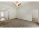 Spacious bedroom with plush carpeting and a ceiling fan, offering a comfortable and airy feel at 418 Ivy Bank Dr, Angier, NC 27501
