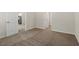 A simple bedroom offers comfortable carpet, neutral walls and trim, and doorway to other living areas at 418 Ivy Bank Dr, Angier, NC 27501