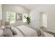 Inviting bedroom with soft lighting, neutral tones, and a view of the outside at 418 Ivy Bank Dr, Angier, NC 27501