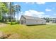 Well-maintained home with a large manicured lawn, with a view of the back and side yard at 418 Ivy Bank Dr, Angier, NC 27501