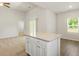 Open-concept kitchen island with granite countertop, seamlessly connecting the kitchen and living spaces at 418 Ivy Bank Dr, Angier, NC 27501