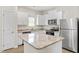 Well-appointed kitchen with white cabinets, granite countertops, and stainless steel appliances at 418 Ivy Bank Dr, Angier, NC 27501