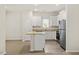 Modern kitchen featuring white cabinetry, granite countertops, and stainless steel appliances at 418 Ivy Bank Dr, Angier, NC 27501