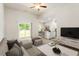 Bright living room featuring an open layout, sliding doors, and modern neutral decor at 418 Ivy Bank Dr, Angier, NC 27501
