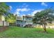 The backyard features a well-maintained lawn and a charming deck, perfect for outdoor relaxation and entertaining at 4309 Birmingham Way, Raleigh, NC 27604