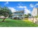 This backyard is spacious, featuring a white deck, large lawn area and fenced perimeter, perfect for entertaining at 4309 Birmingham Way, Raleigh, NC 27604