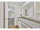 Bathroom featuring a granite vanity with bright vanity lighting at 4309 Birmingham Way, Raleigh, NC 27604