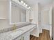 Bathroom with granite countertop, white vanity, a makeup area, and tile flooring at 4309 Birmingham Way, Raleigh, NC 27604